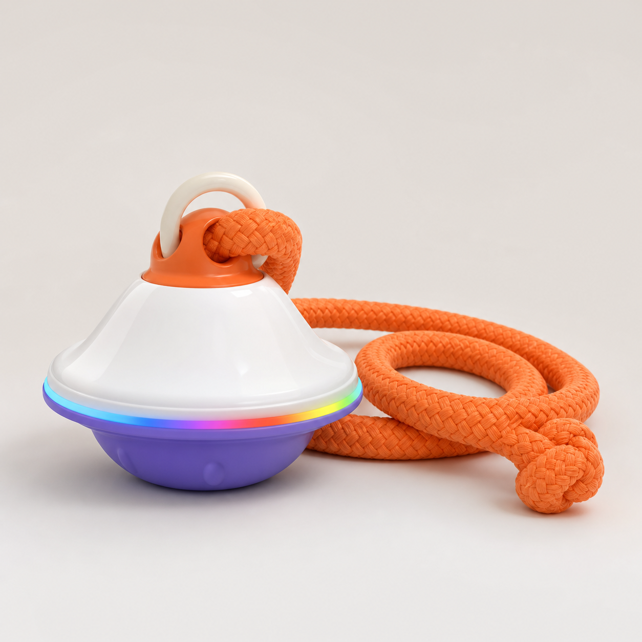 New white and purple UFO dog toy with braided orange rope